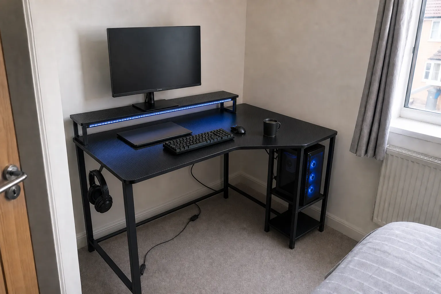Bestier compact black L-shaped desk set up in a small UK bedroom corner