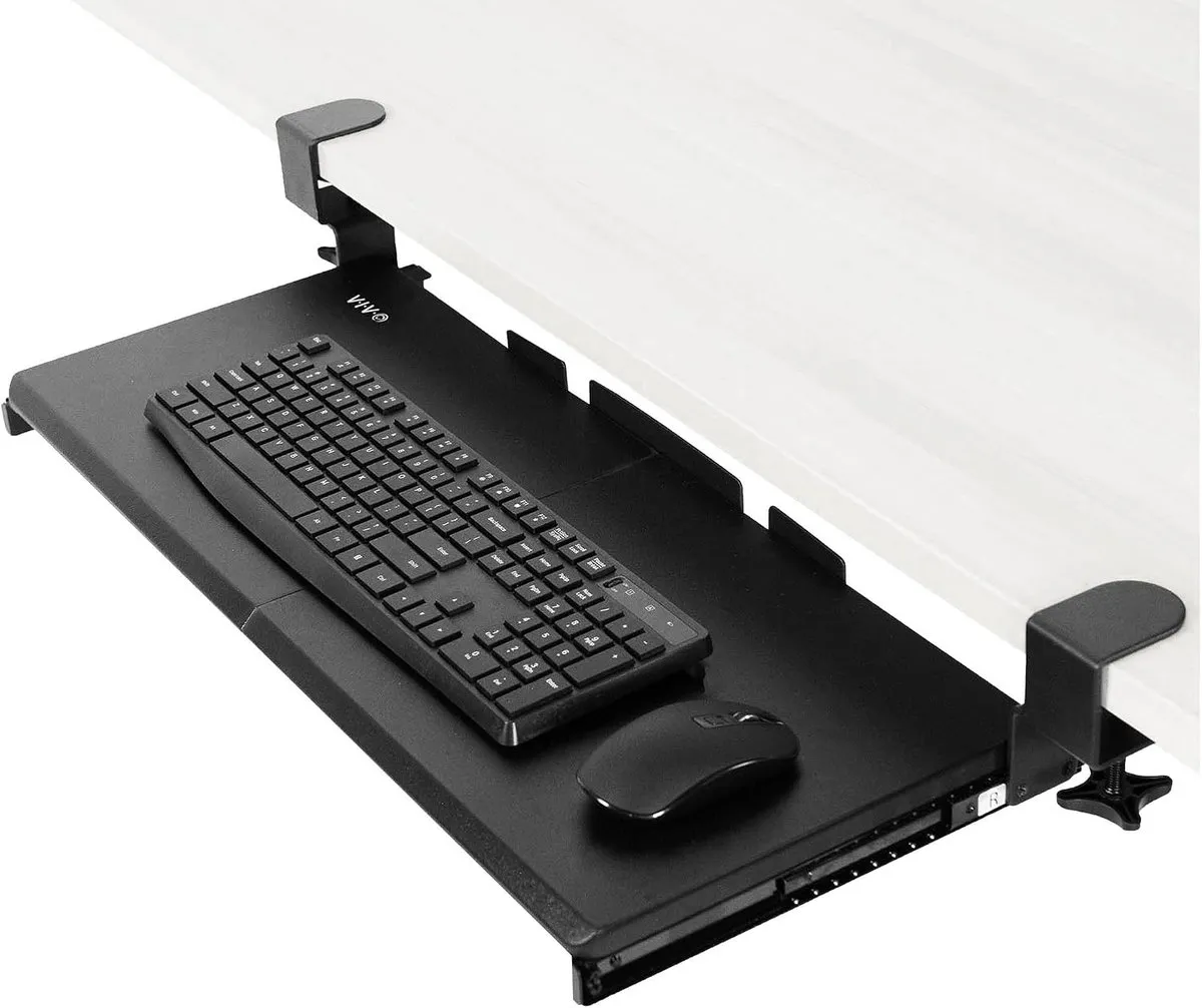 Black VIVO keyboard tray clamped to the front edge of a white desk, pulled out with a keyboard and mouse on it
